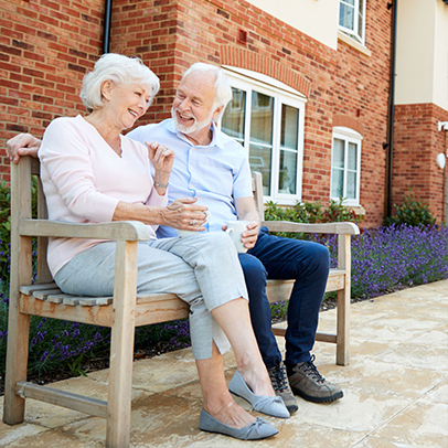 Group of older adults participating in seated exercises in community room
